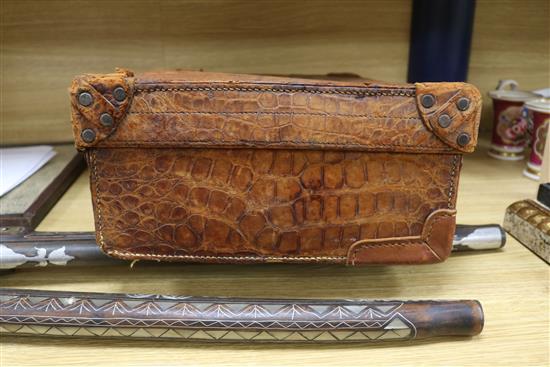 An early 20th century crocodile skin briefcase and a suitcase length 49cm